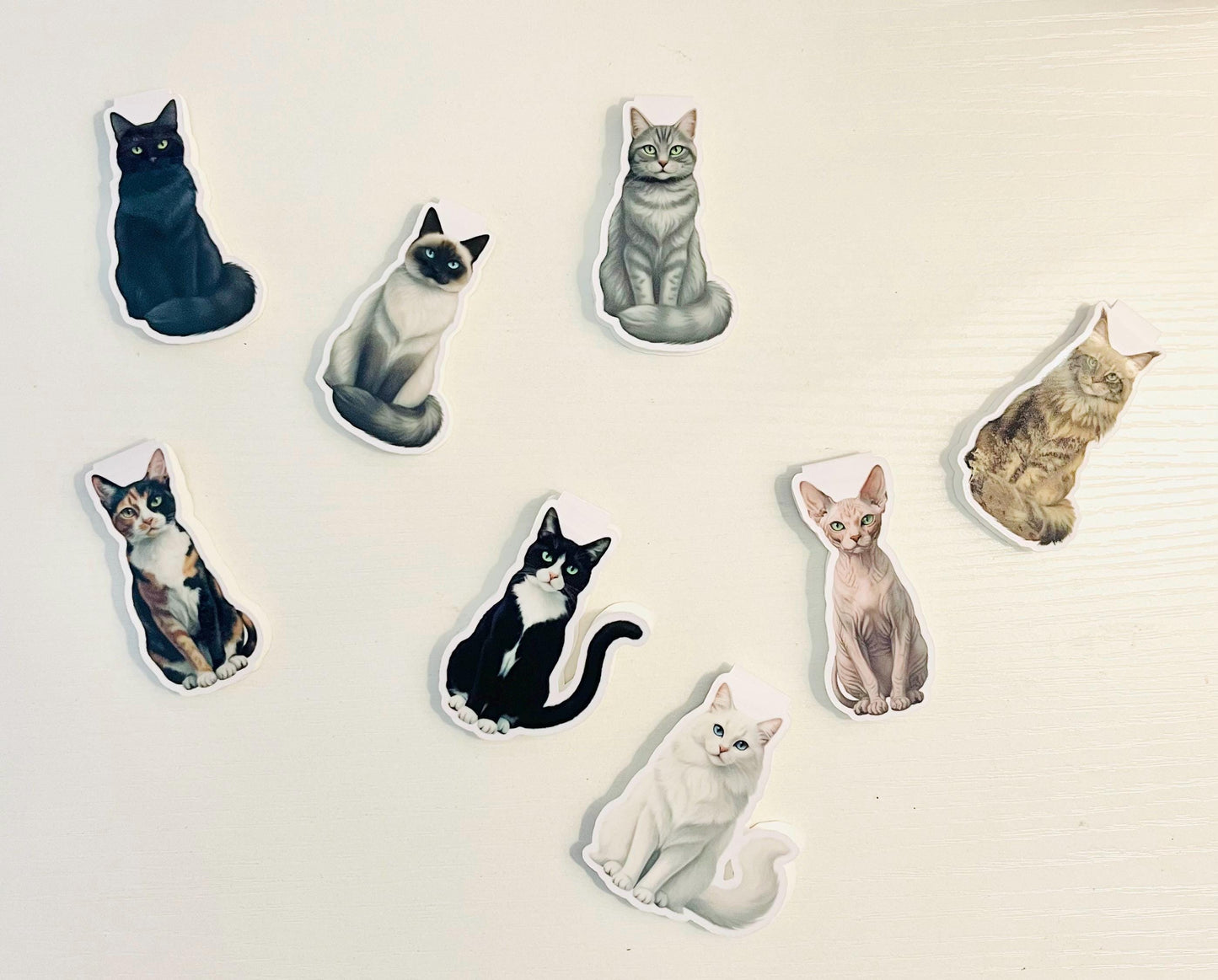 Image that shows a bunch of different cat bookmarks together
