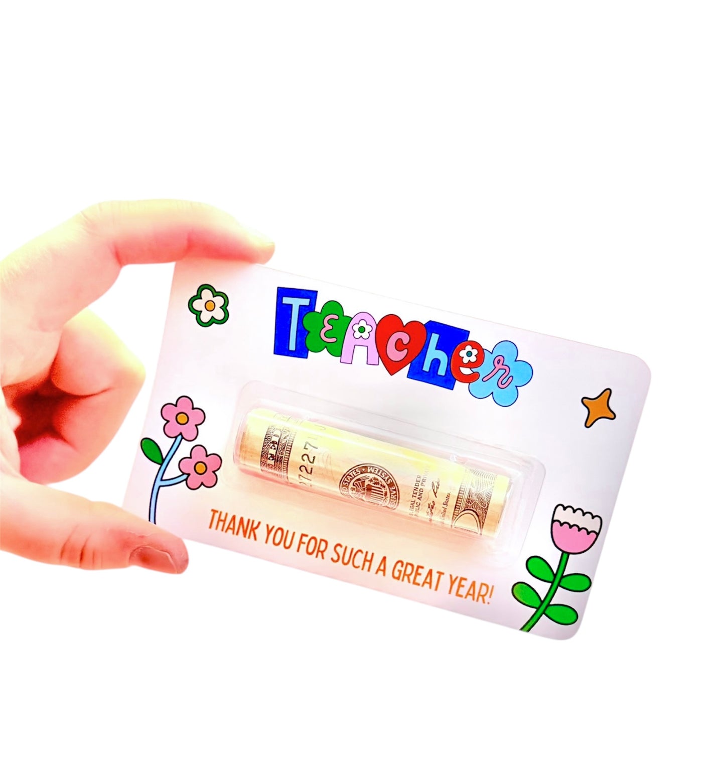Hand holding a small card with cash and 'Teacher' text on a white background