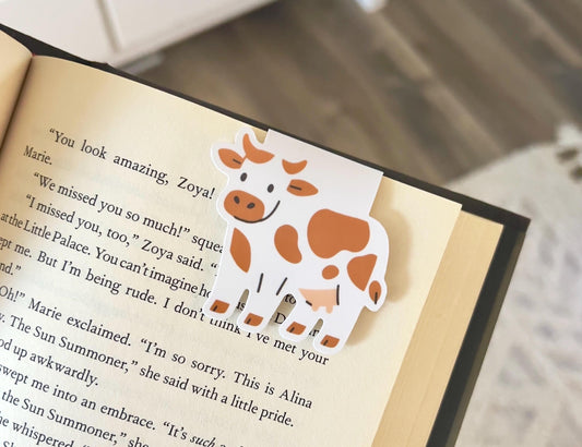 A magnetic bookmark of a simple, cartoon style brown spotted cow