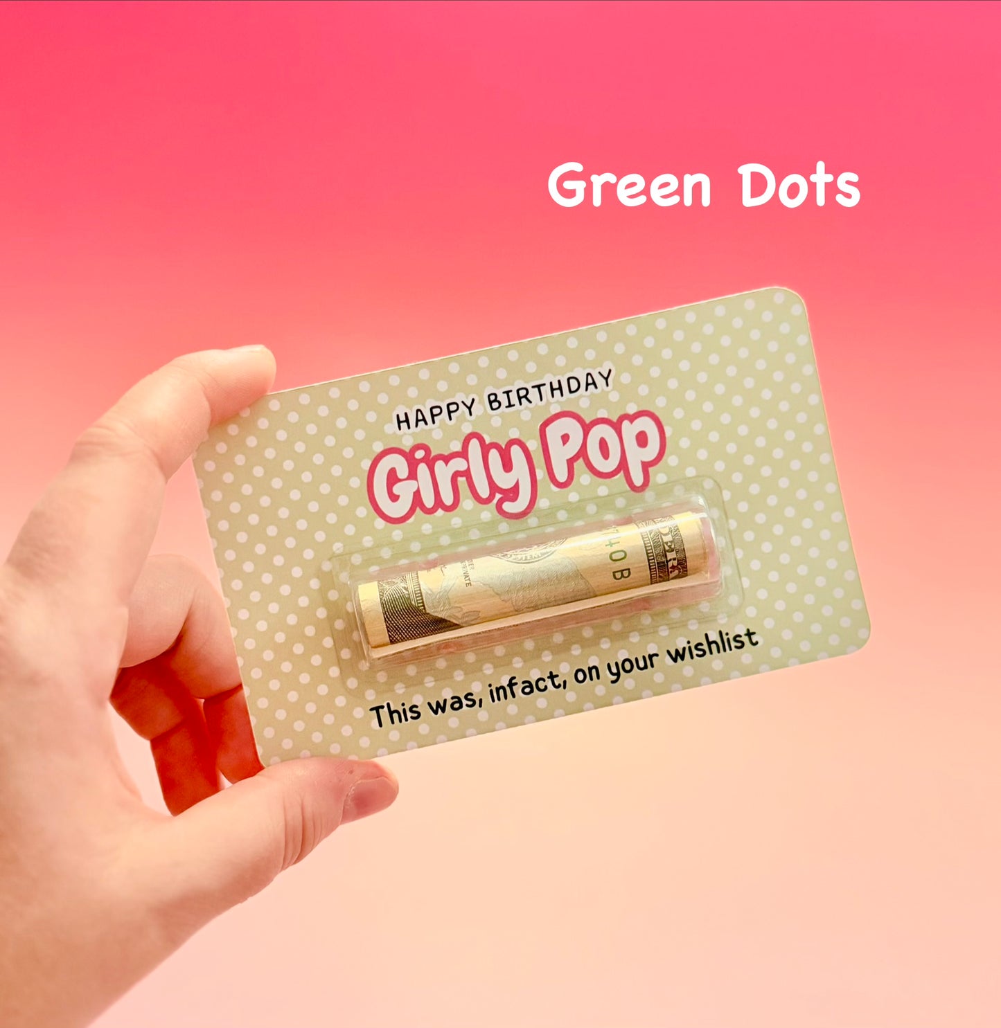 Hand holding a 'Happy Birthday Girly Pop' product with a pink background