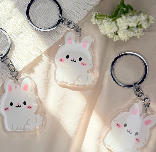 An acrylic Kawaii style white Easter bunny keychain