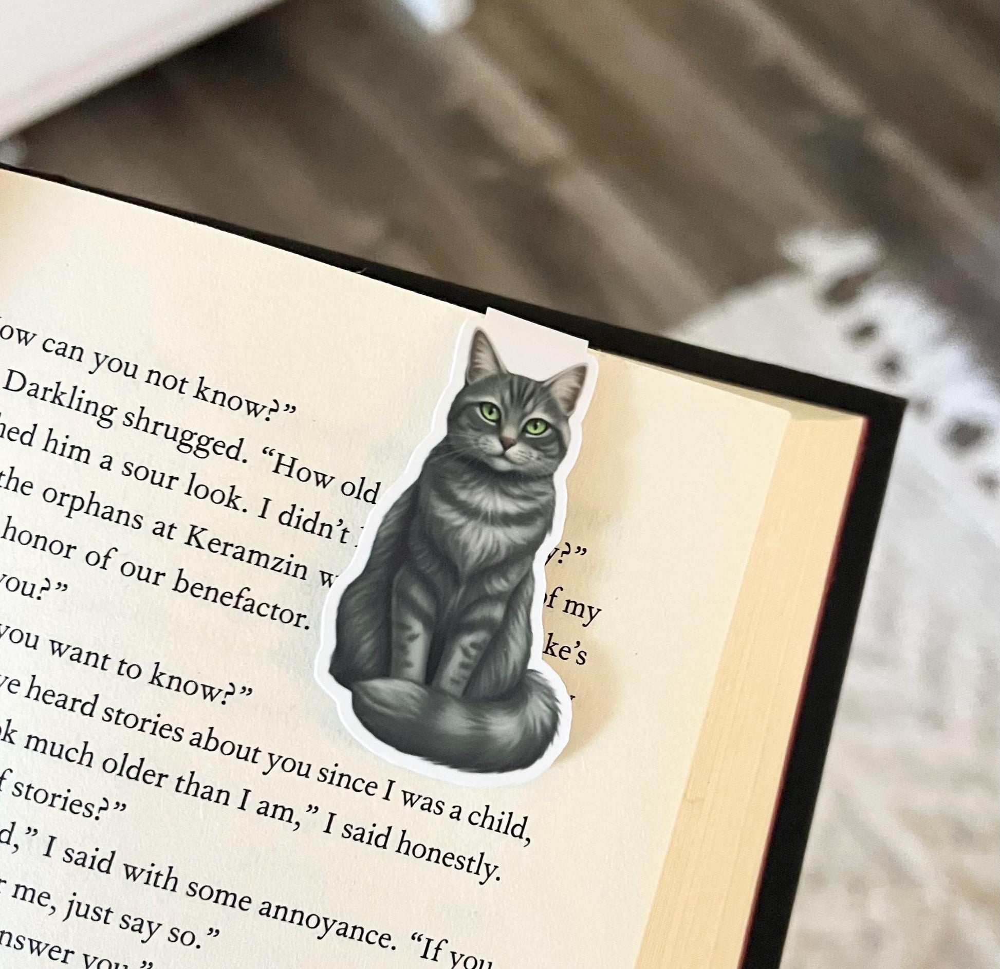 Magnetic bookmark of a semi realistic, cartoon style, gray tabby cat
