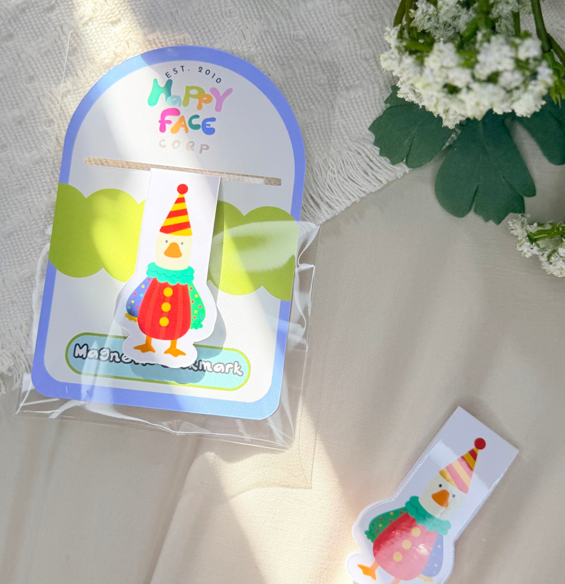 silly goose magnetic bookmark wearing a colorful clown costume