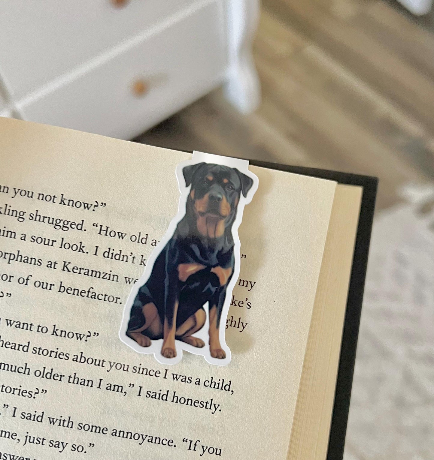A magnetic bookmark of a semi realistic, cartoon style Rottweiler