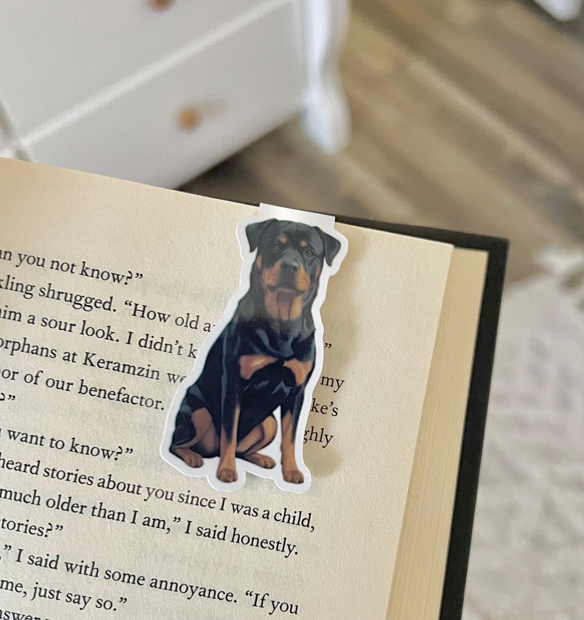 A magnetic bookmark of a semi realistic, cartoon style Rottweiler