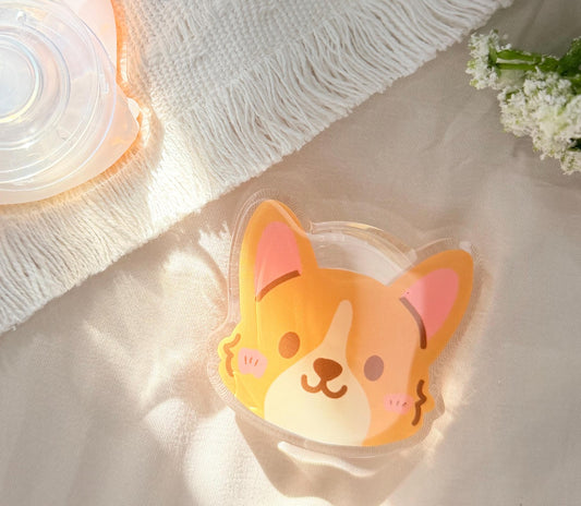 An acrylic phone grip of a Kawaii style corgi face