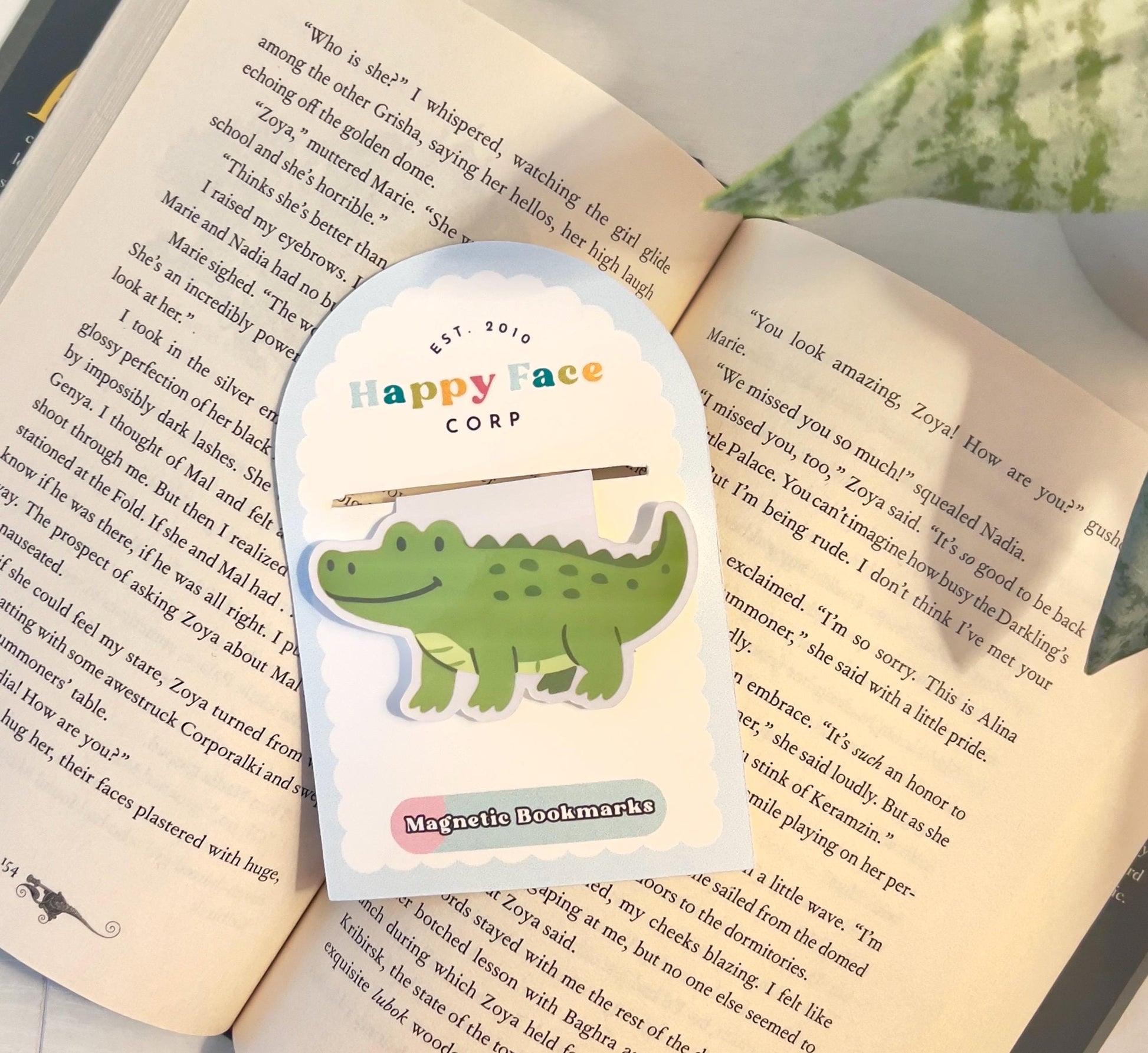 The cartoon style alligator bookmark displayed in its packaging