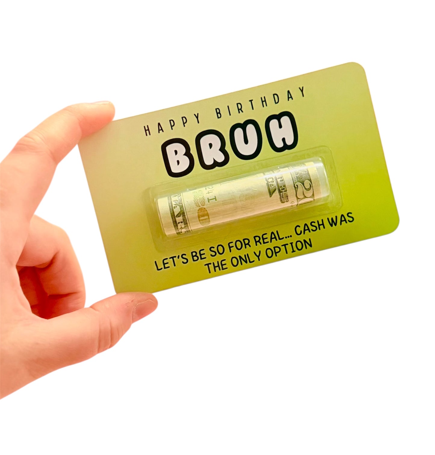 Hand holding a birthday card with a humorous message and money design on a white background