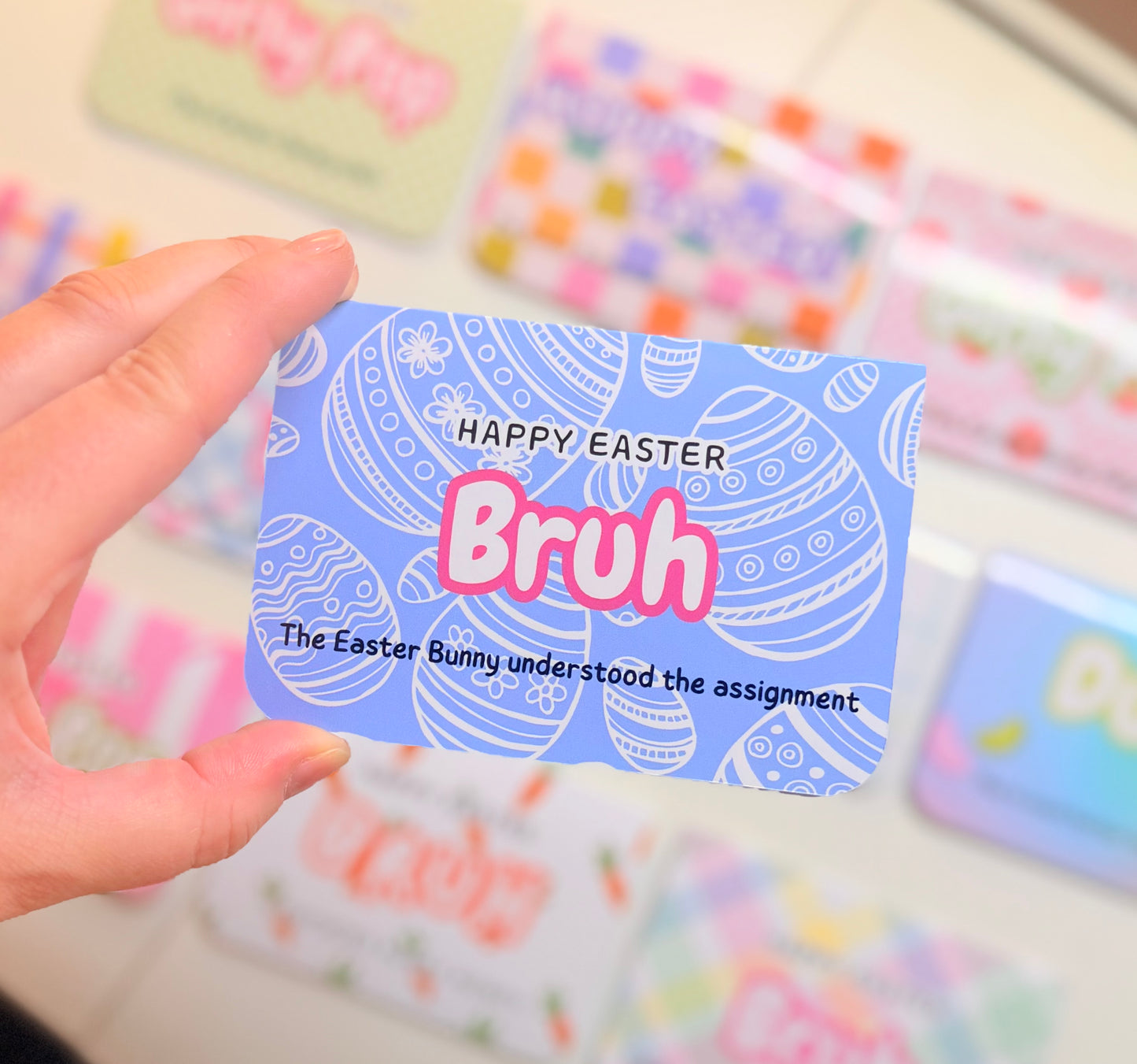 Hand holding one of the gift card holders to show size