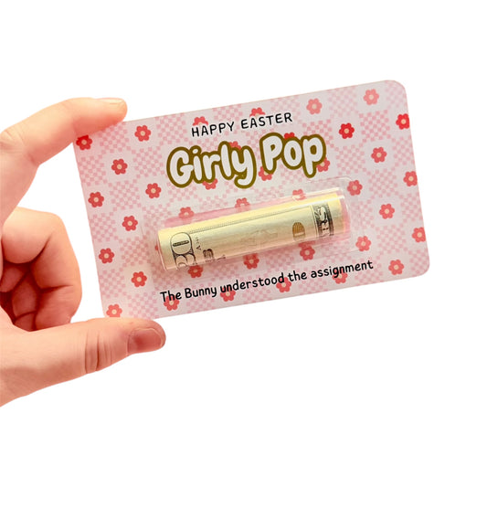 Hand holding a product with 'Happy Easter Girly Pop' packaging on a white background