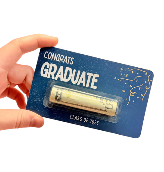 Hand holding a 'Congrats Graduate' card  Class of 2026