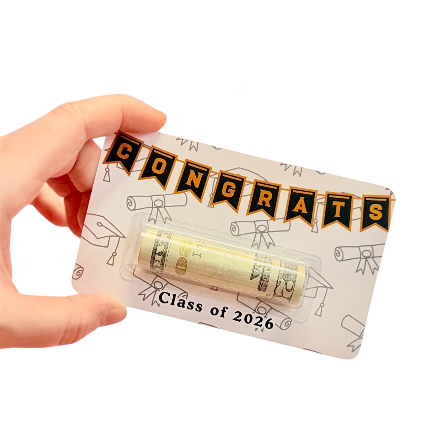 Hand holding a small package with 'Congrats Class of 2026' text and dollar bills inside.