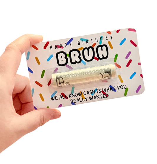 Hand holding a gift card with colorful sprinkles and text on a white background