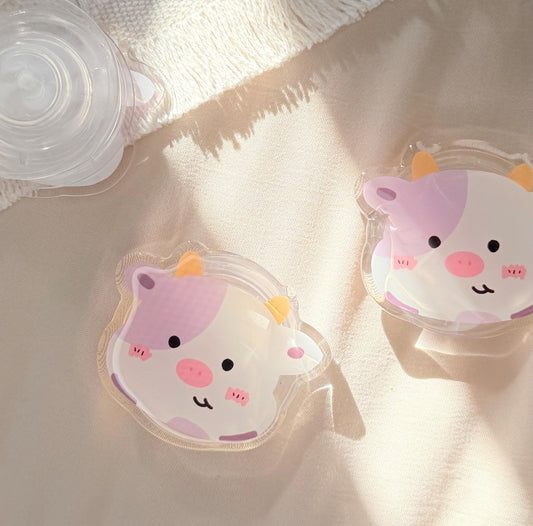 An acrylic foam grip of a Kawaii style purple spotted cow face