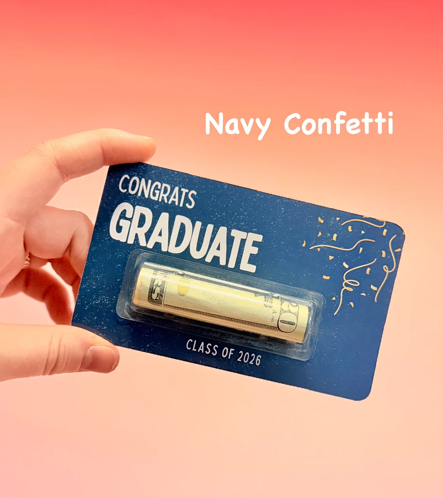 Graduation-themed card with 'Congrats Graduate' text and navy confetti on a pink background