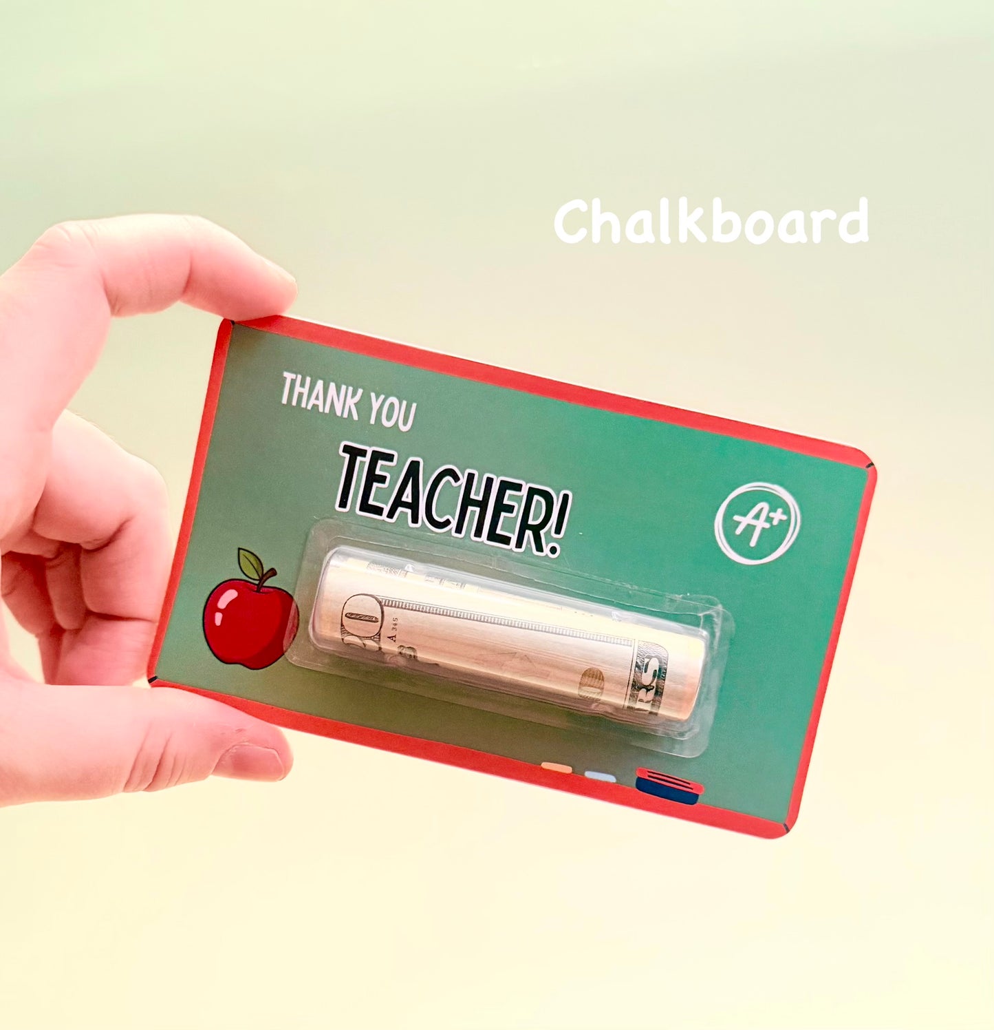 Hand holding a 'Thank You Teacher' gift card with a cash rolls on a light green background