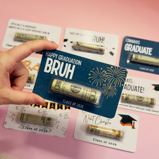 Graduation-themed gift card with 'Happy Graduation Bruh' text and gold tube on a pink background.