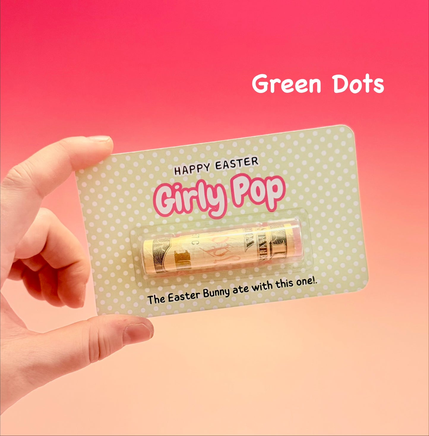 Hand holding a product packaging with 'Happy Easter Girly Pop' text on a pink background