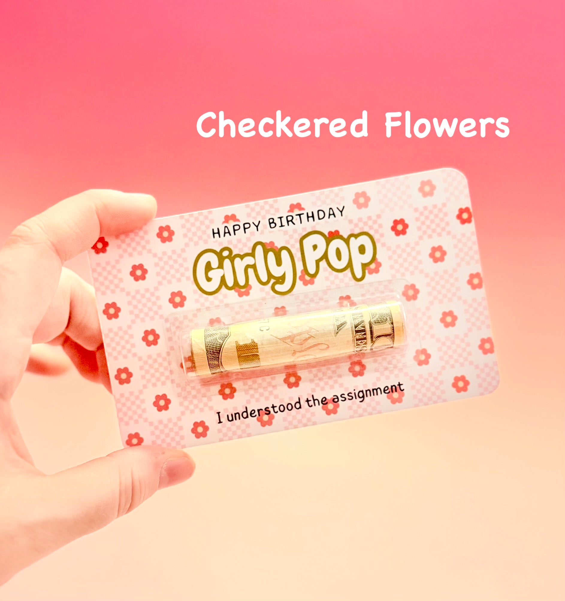 Hand holding a product with 'Happy Birthday Girly Pop' text on a pink background
