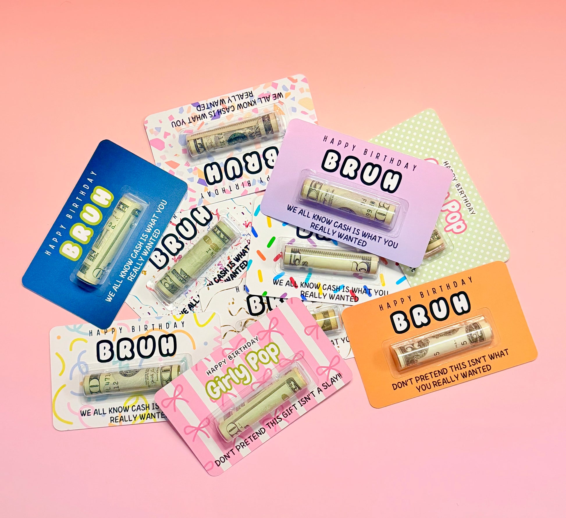 Set of novelty cards with cash designs on a pink background