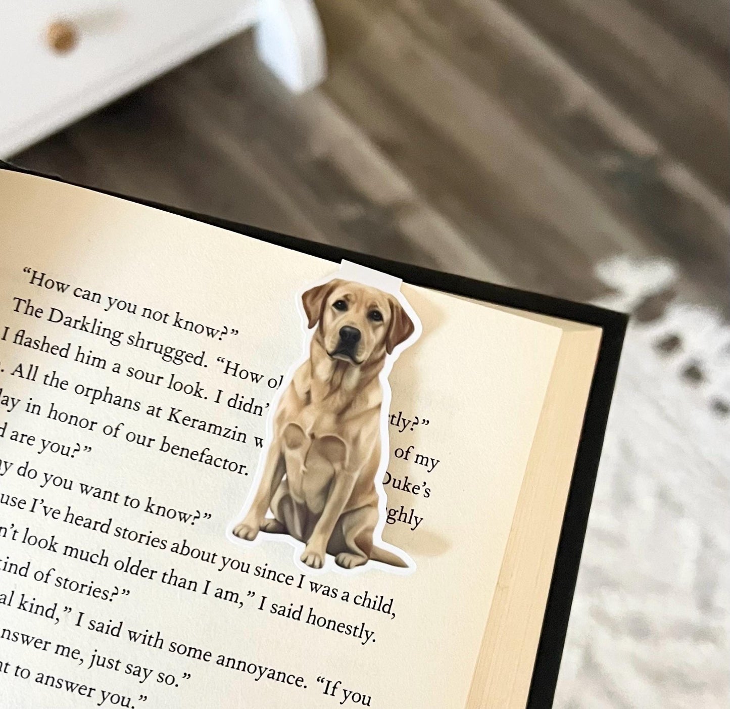 A magnetic bookmark of a semi realistic, cartoon style yellow Labrador