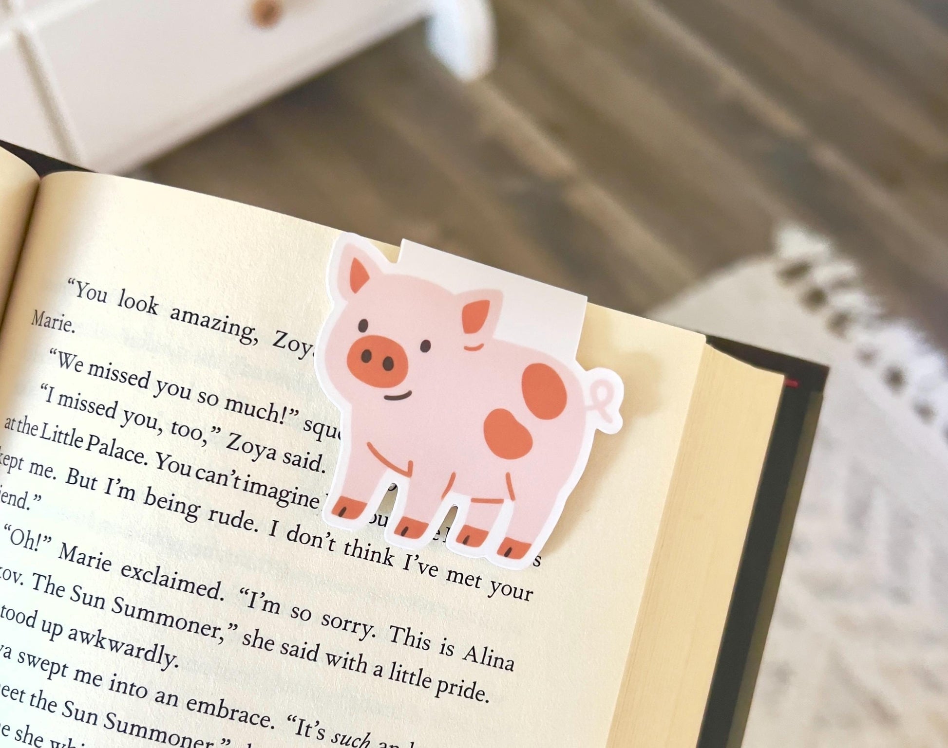 Magnetic bookmark of a cute pink, cartoon pig