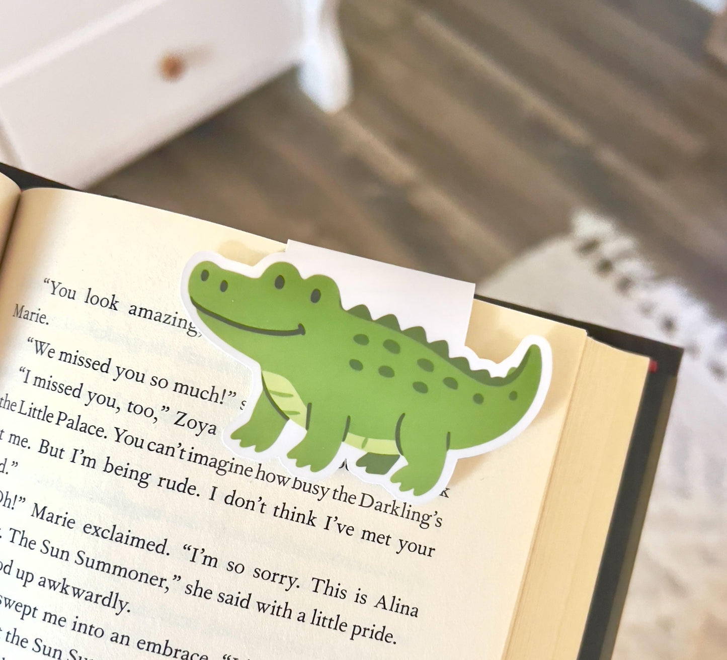 A magnetic bookmark of a cartoon style alligator