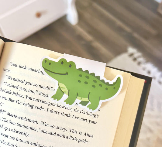 A magnetic bookmark of a cartoon style alligator