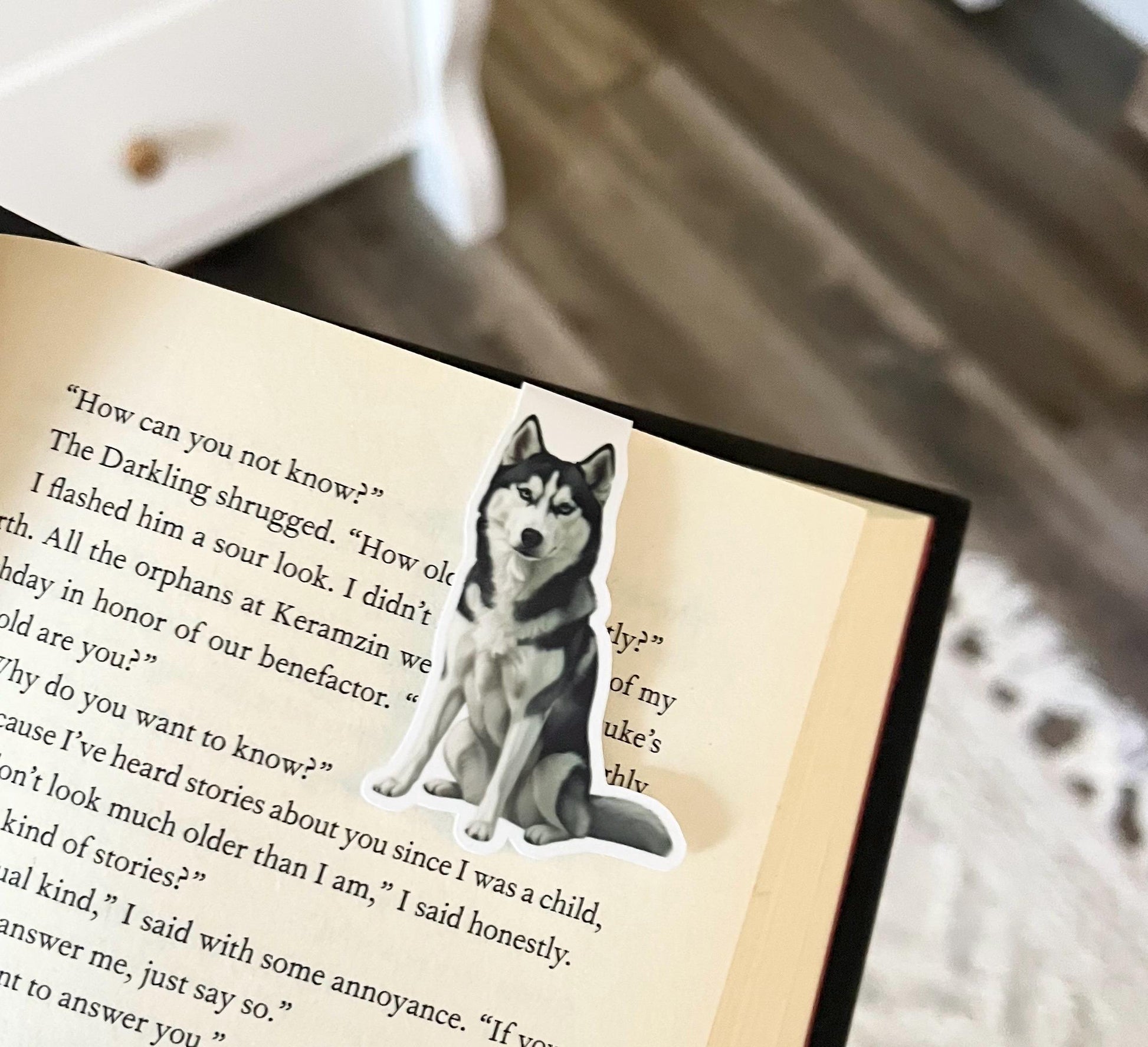 A magnetic bookmark of a semi realistic, cartoon style husky dog