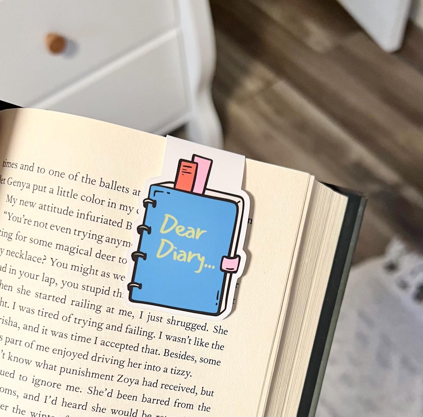 
Magnetic bookmark of a blue cartoon journal That says, dear diary on the front