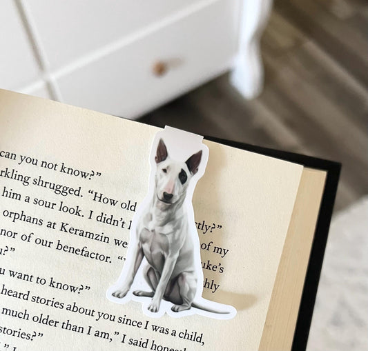 A magnetic bookmark of a semi realistic, cartoon style white bull terrier