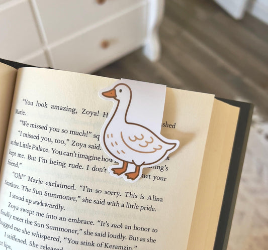 A magnetic bookmark of a plane, cartoon style white goose
